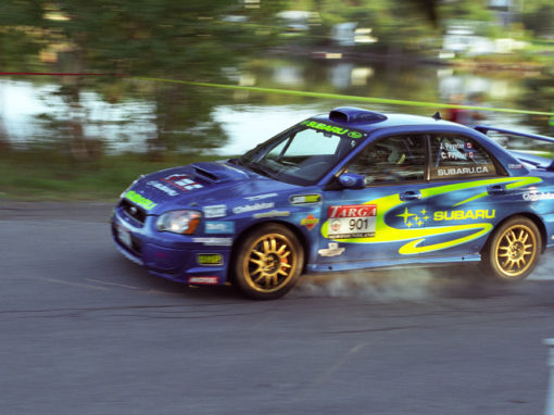 This photo illustrates the Subaru 901 car at Targa Newfoundland 2007. This is a tight corner approaching in Clarenville, Newfoundland.